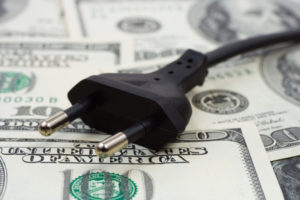 Cost Electric Plug On Money Shutterstock 9078670