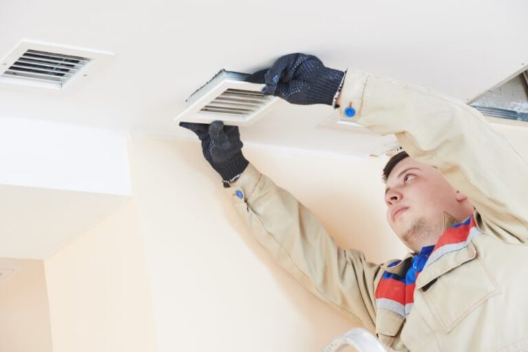 Man Maintaining Ducts
