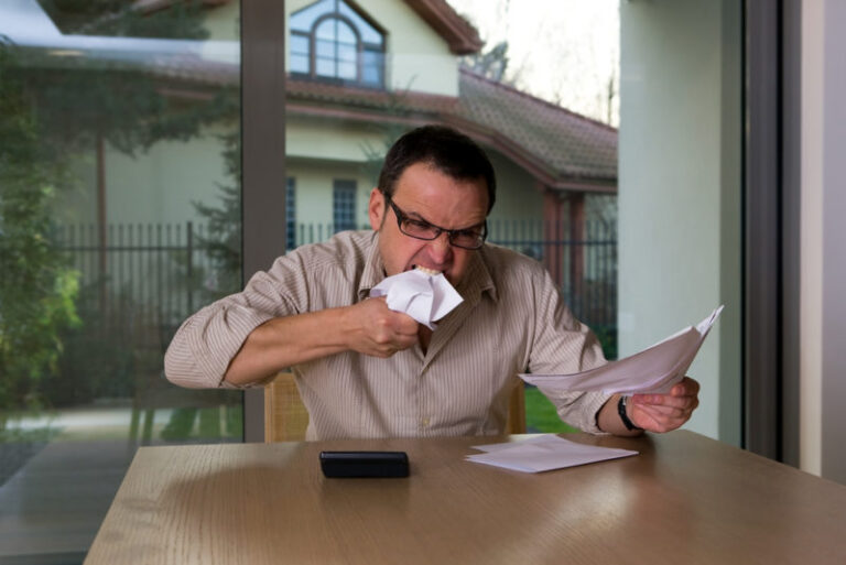 Man Looking At Bills