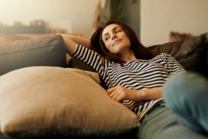 Woman Relaxing On Her Couch