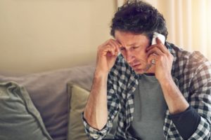 Man Stressed On Phone