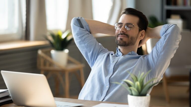 Young Man Relaxes In Office