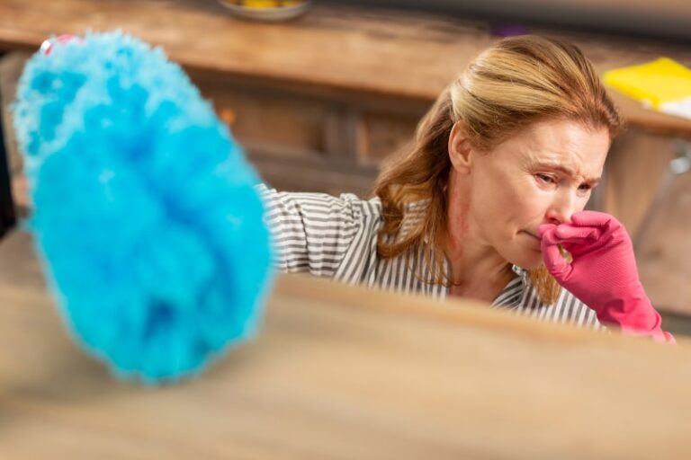 Woman Coughing While Cleaning Dusty Room